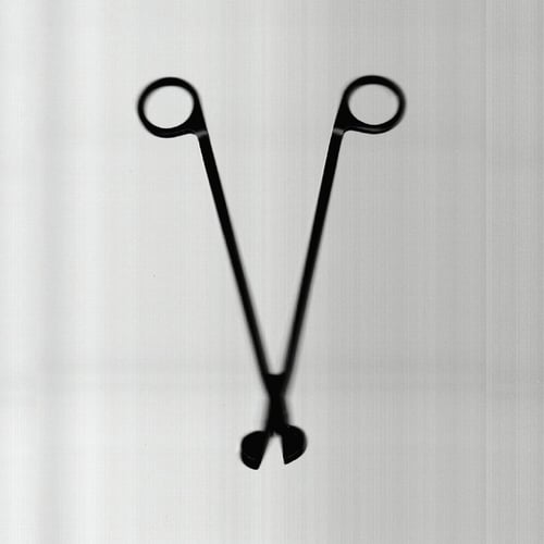 أداة قص فتيل الشمع