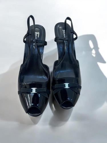 ferragamo black patrnt heels ( brand new)