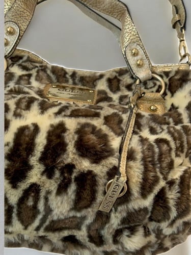 - Guess Faux Fur Animal Print Handbag.