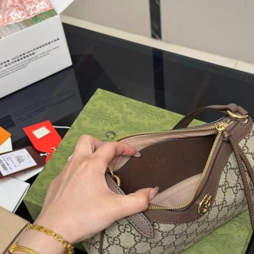 شنطة قوتشي بني