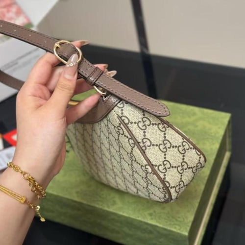 شنطة قوتشي بني