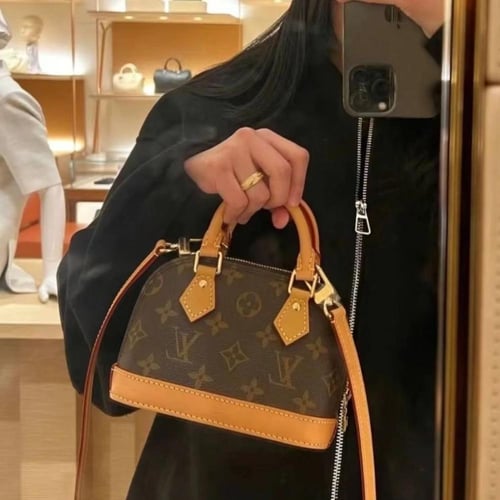 شنطة LV ( بني + اورنج )