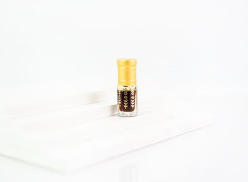 دهن العود تراد ربع توله