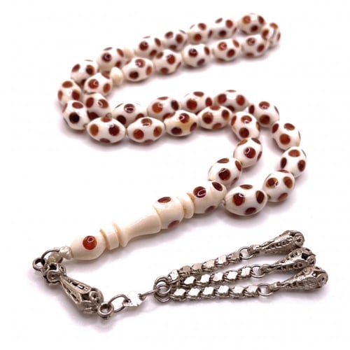 سبحة عاج مطعّم كهرمان