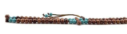 سبحة خشب جوز الكوك مطعمة بحبات من أحجار الفيروز ال...