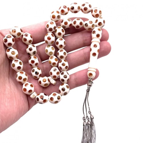 سبحة عاج مطعّم كهرمان