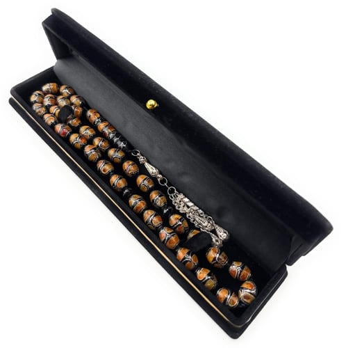 سبحة المرجان الاسود (اليسر) المطعمة بالكهرمان والف...