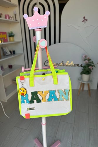 شنطة بالإسم (اخضر فسفوري)