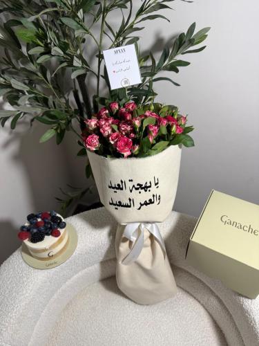 A bouquet of flowers with a cake