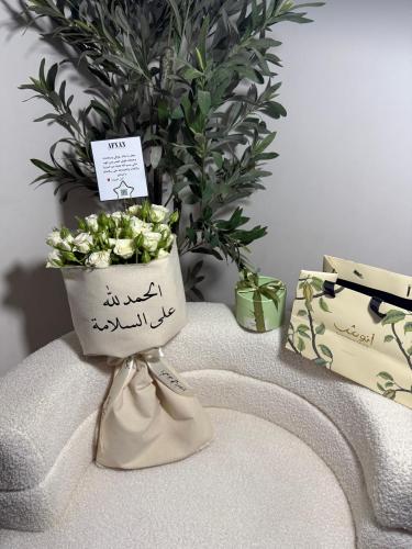 A bouquet of flowers with Anush chocolates