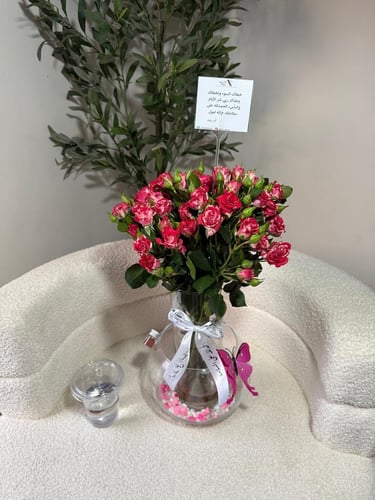 Two vases of fish with natural roses