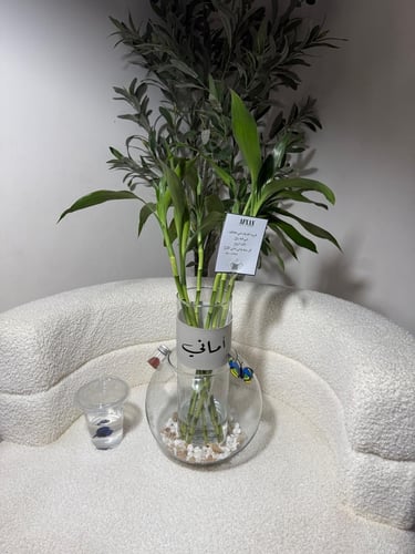 Fish vase with bamboo stalk vase and name on leath...