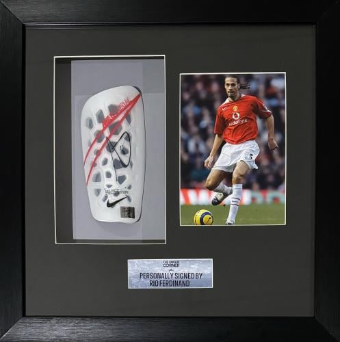 FRAMED RIO FERDINAND HAND SIGNED SHIN GUARD