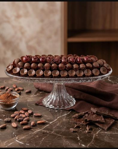 Uncovered chocolate with cheesecake filling, pomeg...