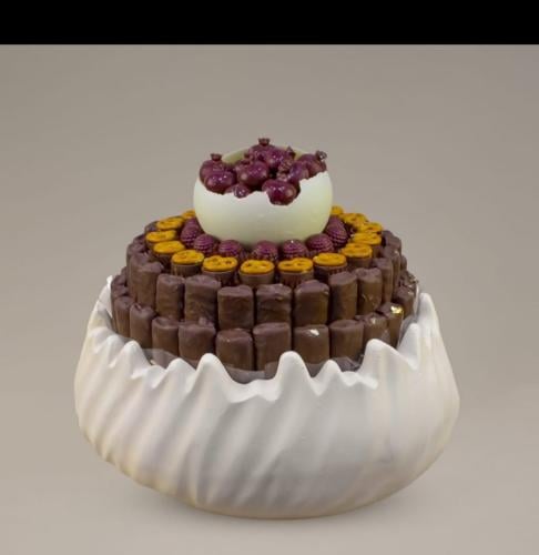 Chocolate with open top filled with berry, crepe b...