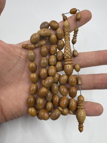 سبحة عاج الماموث المنقرض الشاهد نقش يدوي