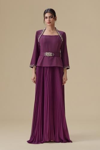 Long evening dress with tulle details and a luxurious crystal belt