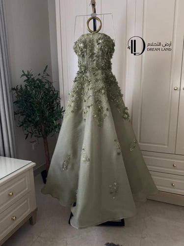 فستان سهرة أخضر بقصة أميرات