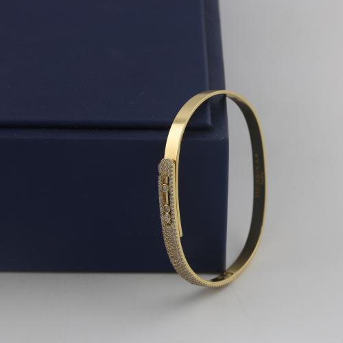 Gold bracelet standing with a part of shiny stones - 18 karat