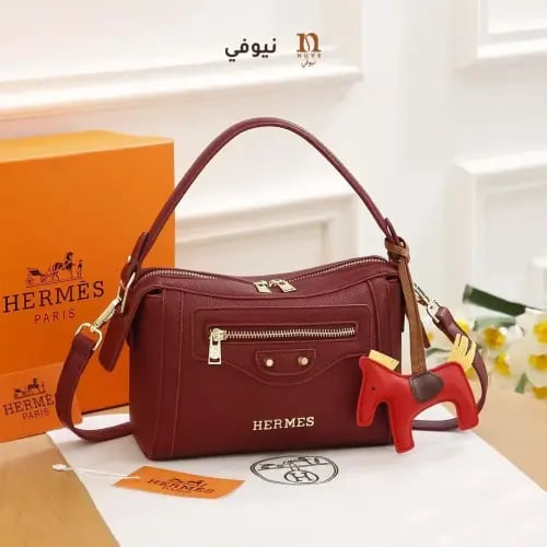 شنطة هرمز أحمر خمري كلاسيكية نسائية عصرية بلمسات ف...