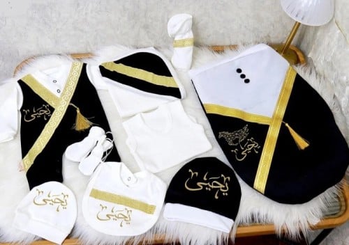 طقم مواليد بشت ملكي بالاسم