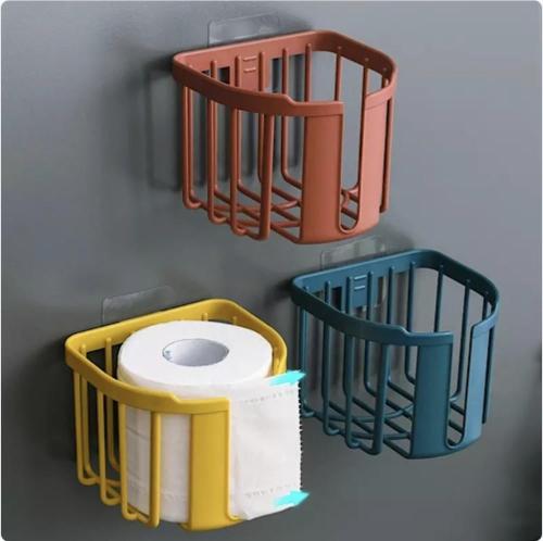 Bathroom tissue roll holder with adhesive