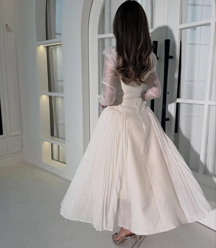 فستان العيد أبيض فاخر بتصميم راقي