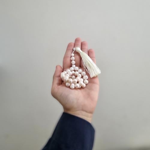 Natural pearl prayer beads with caramel-colored kn...
