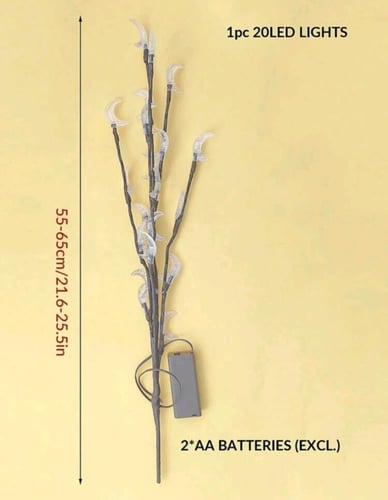 إضاءة فنية على شكل فروع شجر مصممة على شكل هلال