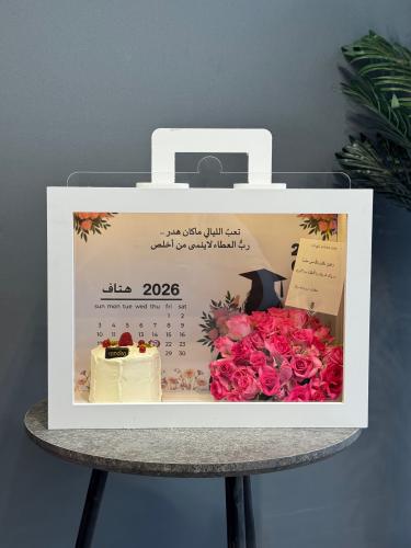 Graduation box gift, flowers and cake