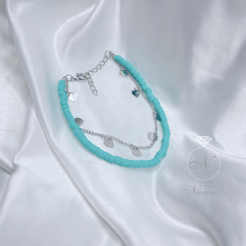 خلخال مزين بحبات من الخرز بلون تفاني يتكون من سلسل...