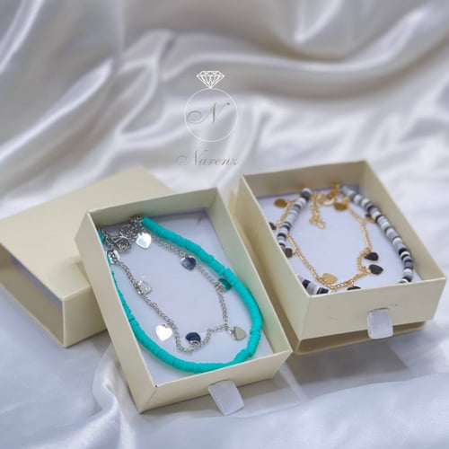 خلخال مزين بحبات من الخرز بلون تفاني يتكون من سلسل...