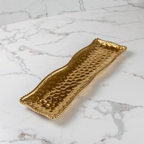 طبق تقديم ذهبي