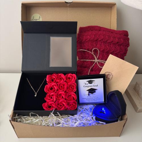 Graduation gift contains: red shawl, red rose box,...