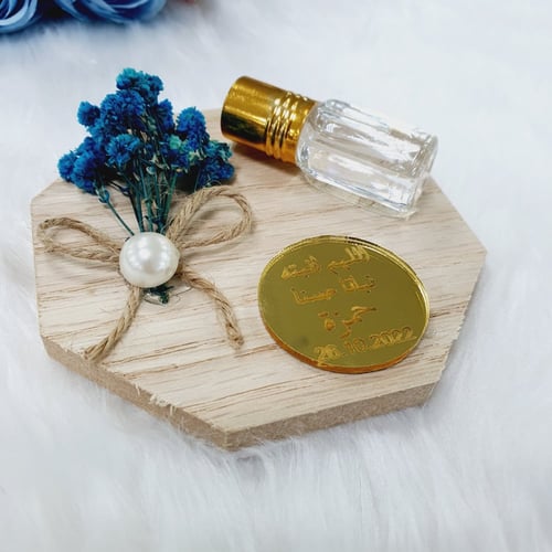 مجموعة (12) تولة عطر مسك بقاعدة ورد مع التنسيق ولو...