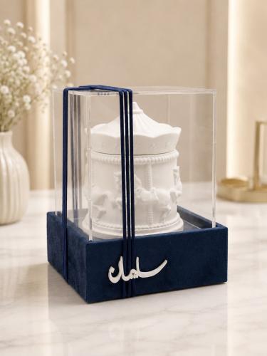 Set of (12) amusement boxes with a velvet base, ma...