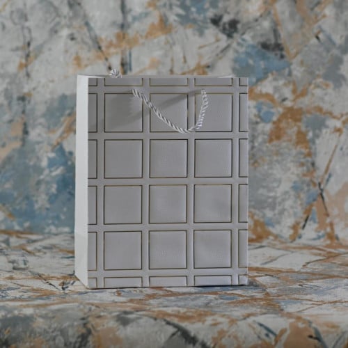 مجموعه (12) اكياس توزيعات ابيض مع مخطط ذهبي