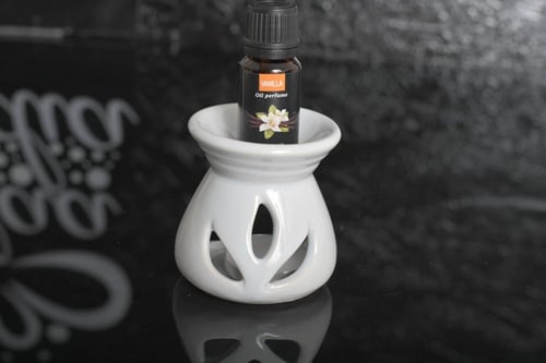 مجموعه(12) فواحة سيرميك مع شمعه