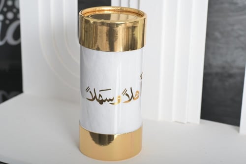 مجموعه (12) مناديل اسطواني ذهبي بي عبارة اهلآ وسهل...