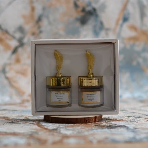 مجموعه (12) شموع زجاج بي علبة شكل ريشة