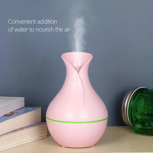 فواحة عطرية أنيقة بشكل مزهرية مع إضاءة خافتة - تعم...