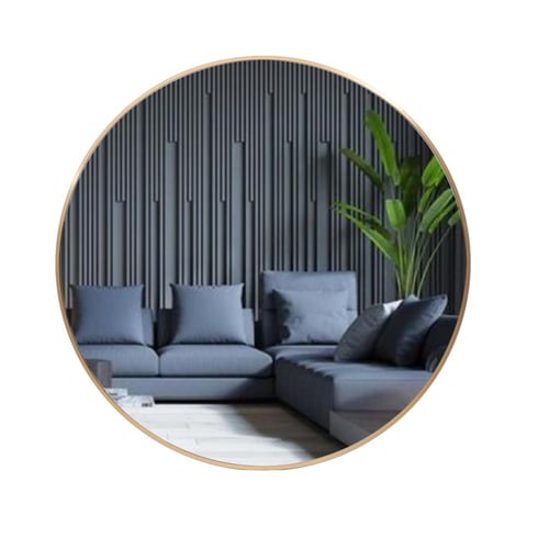 مراية دائرية كبيرة تعلق على الحائط بإطار ذهبي