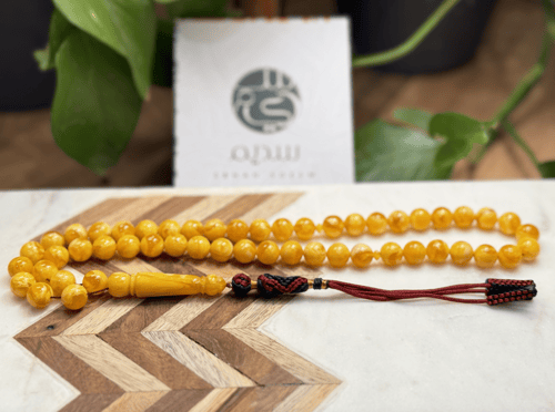 سبحة C61 تراب كهرمان مع تعليقه قماش عدد الخرز 51 م...