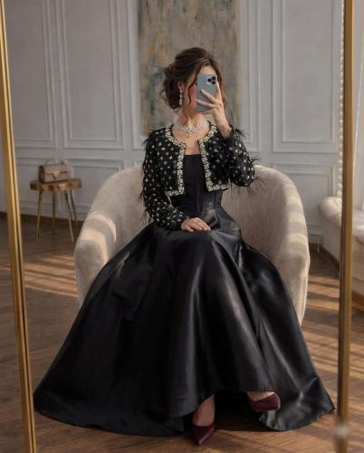 فستان سهرة أسود فاخر بتطريز كريستال وريش - تصميم ق...