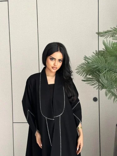 White and black Qaitan abaya
