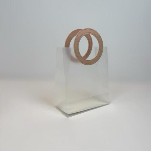 كيس هدايا فاخر شفافة بمسكة جلد دائري لون وردي مقاس...