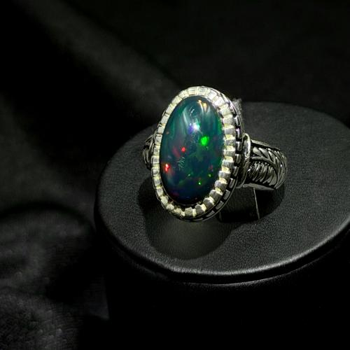 Opal Ethiopian full fire my own design knowing silver 990..size (6.5 US)..length of the stone (16)..width of the stone (10)