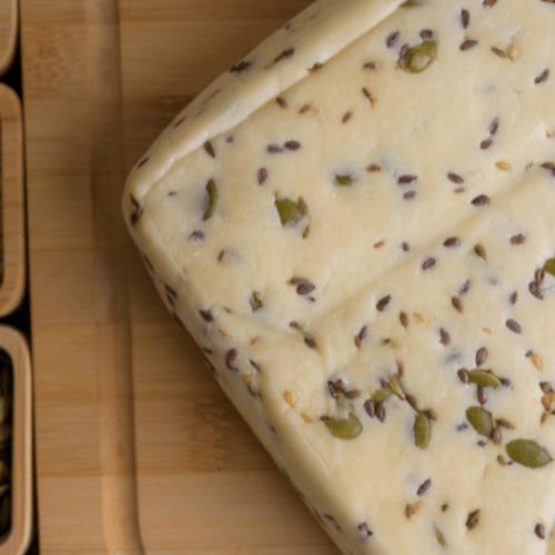 goat cheddar cheese with seeds