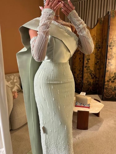 فستان منار بلون التيفاني ولأكمام الشفافة الراقية و...