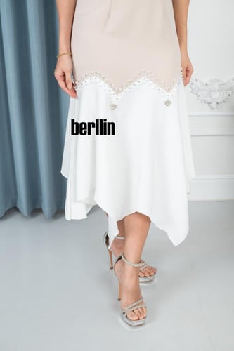 فستان سهره أنيق بتصميم غير متماثل ولمسات فاخرة ممي...